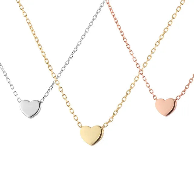 Silver, gold, and rose gold heart necklaces displayed side by side ā a chic trio from the best jewelry store online in Pakistan.