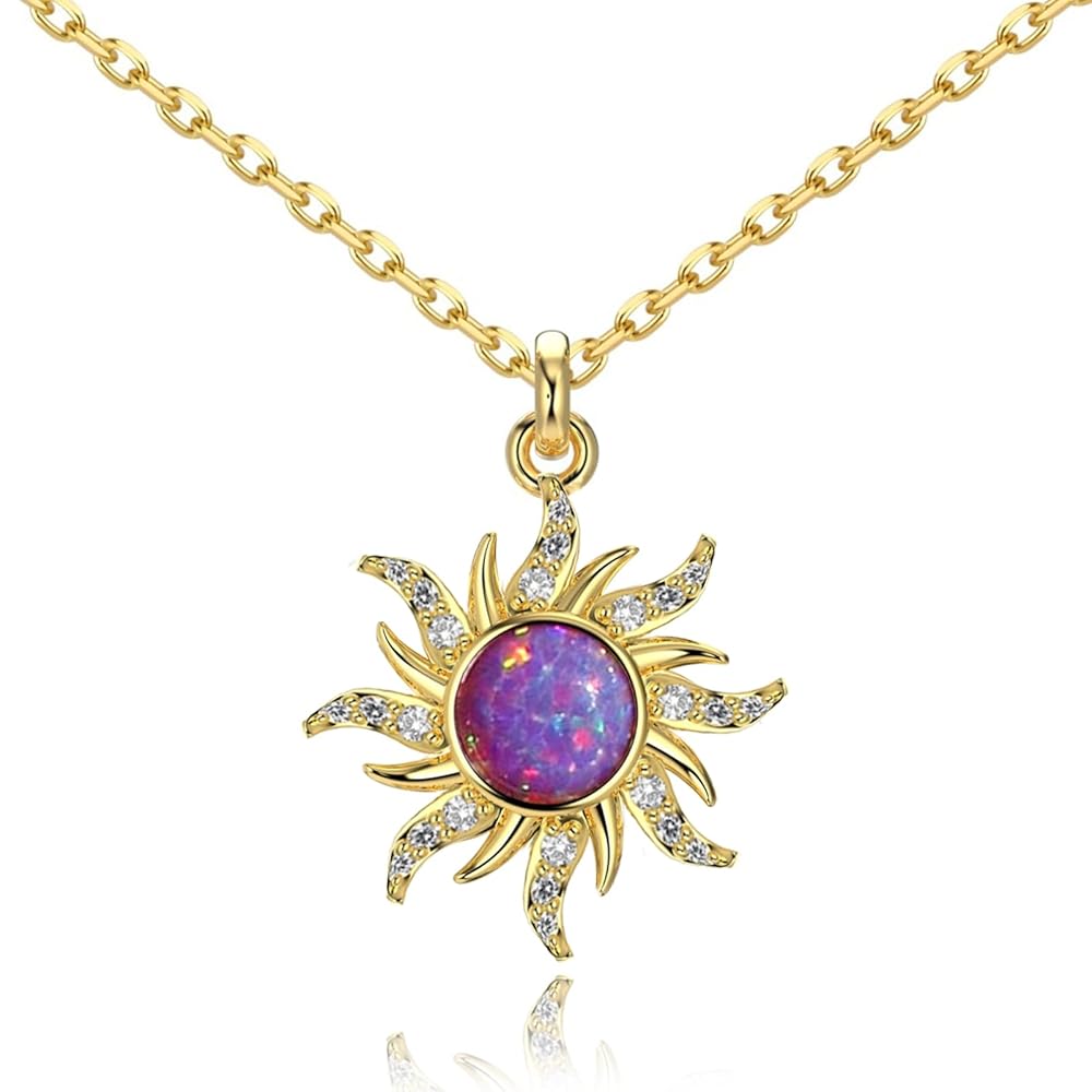 Gold sun-shaped rapunzul pendant with a purple gemstone on a white background