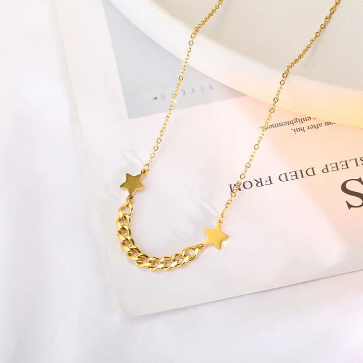 Flat lay of gold titanium star pendant necklace for women – affordable artificial jewellery in Pakistan