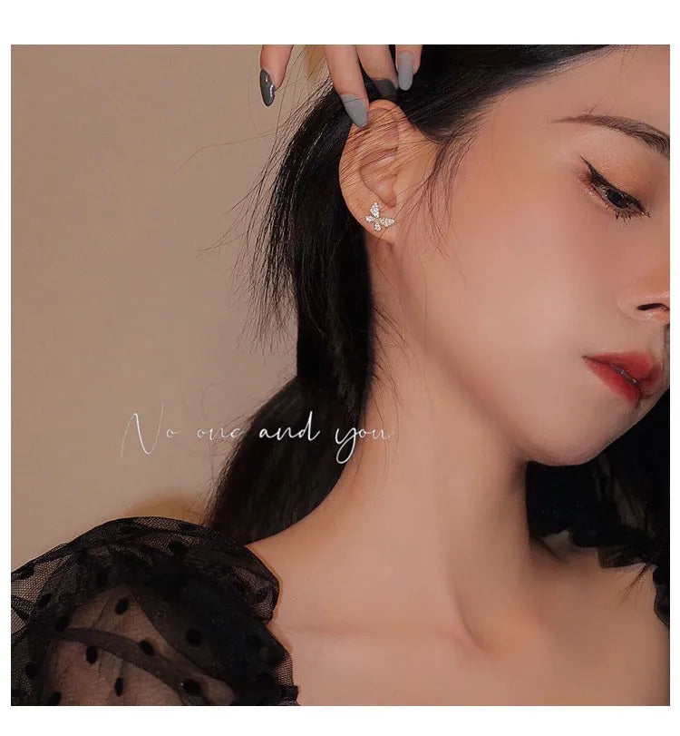 Woman wearing butterfly ear cuff, no piercing needed — a chic, standout piece from the best jewelry store online in Pakistan.