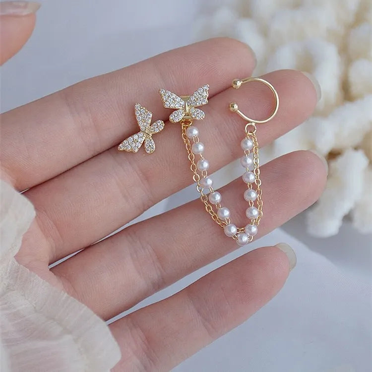 Side view of hanging butterfly ear cuff showing fine 18K gold plating and delicate craftsmanship — Eva & Esh signature style.
