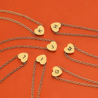 Gold necklaces with heart-shaped pendants on an orange background - Affordbale artificial jewellery in pakistan