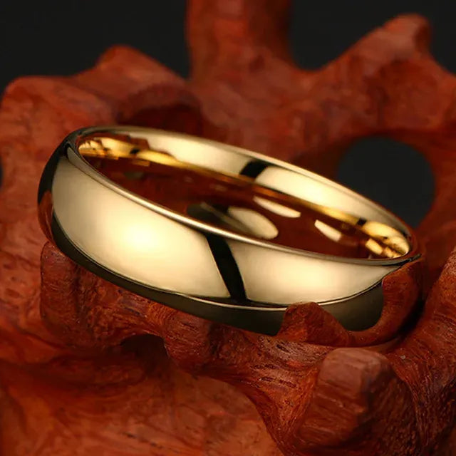 Gold ring on a textured brown surface - Affordable artifiial jewellery in pakistan