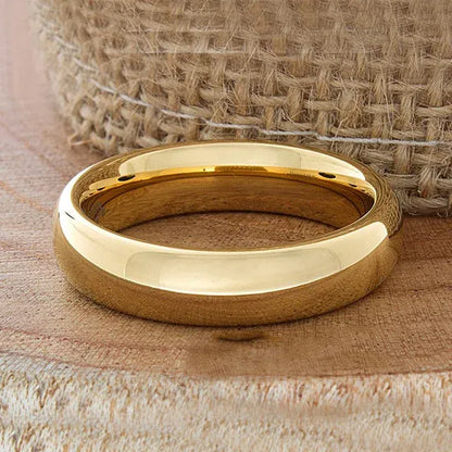 Gold tunsgten ring on a textured wooden surface with burlap in the background - Affordable artifiial jewellery in pakistan