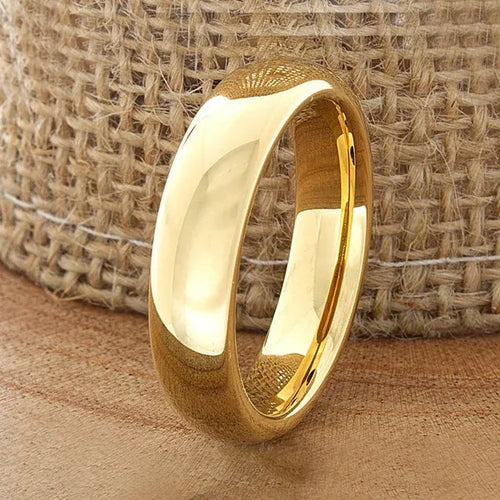 Gold tungsten carbide ring on a textured beige fabric background - Affordable artifiial jewellery in pakistan