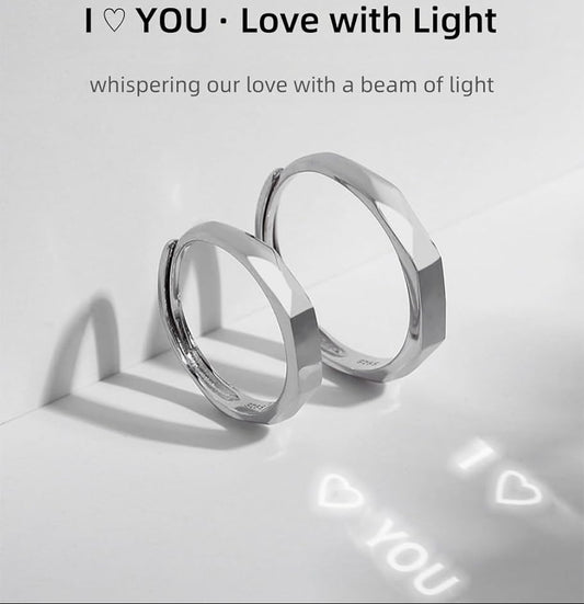 Two silver rings on a light gray background with 'I ❤️ YOU ❤️ Love with Light' text.