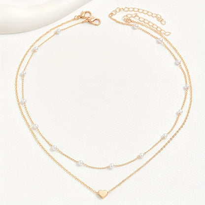 Two gold necklaces with heart pendants on a white background - Affordable Artificial jewellery in pakistan