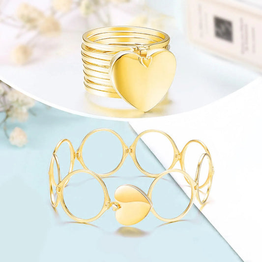 Gold heart-shaped rings on a light blue background