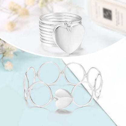 Silver 2 in 1 ring bracelet with heart-shaped ends on a light blue surface