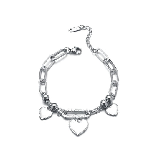 Silver chain bracelet with heart charms on a white background