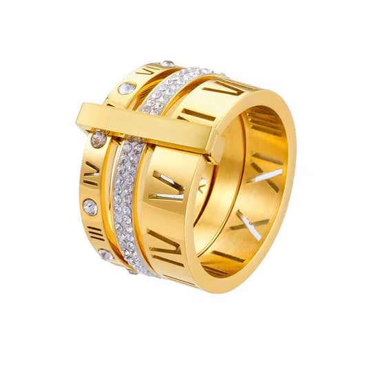 Gold ring with Roman numeral design and embedded diamonds on a white background