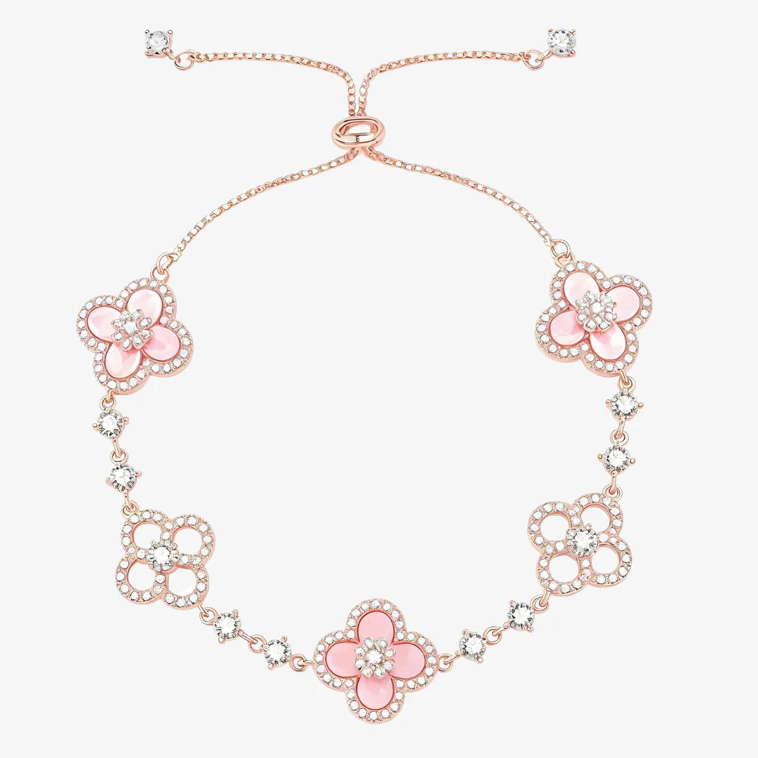 Necklace with pink floral designs and rose gold chain on a white background
