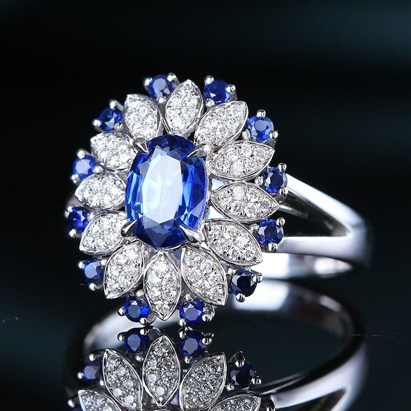 Top-down shot of S925 silver sapphire ring on white background – minimalist product display