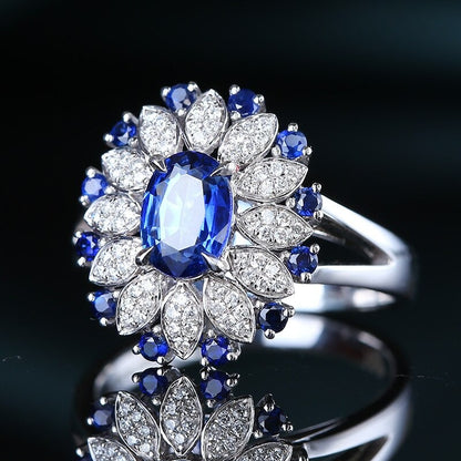 Top-down shot of S925 silver sapphire ring on white background – minimalist product display