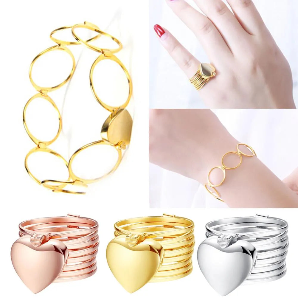 2 in 1 ring bracelet Gold, rose gold, and silver heart-shaped rings displayed with a hand wearing one of the rings.