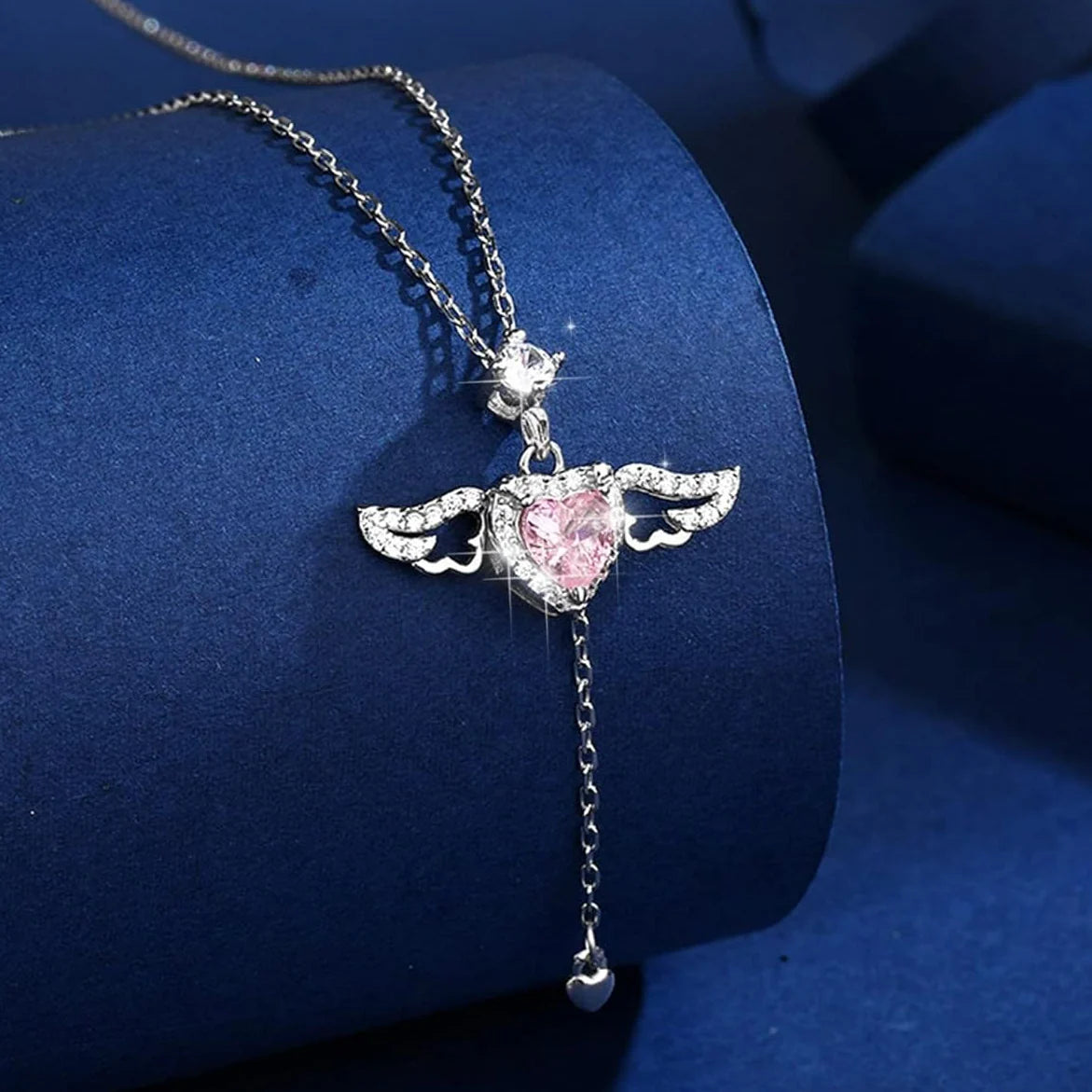 Close-up of zircon diamond angel necklace in silver finish