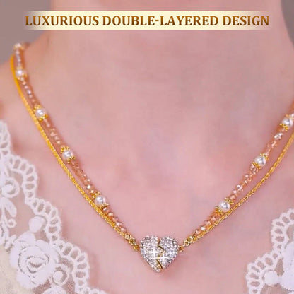 Double-layered necklace with a heart-shaped pendant on a blurred lace background