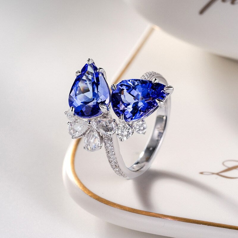Luxury 925 sterling silver open ring with sapphire gemstones displayed, offered by the Best Jewelry Store Online in Pakistan