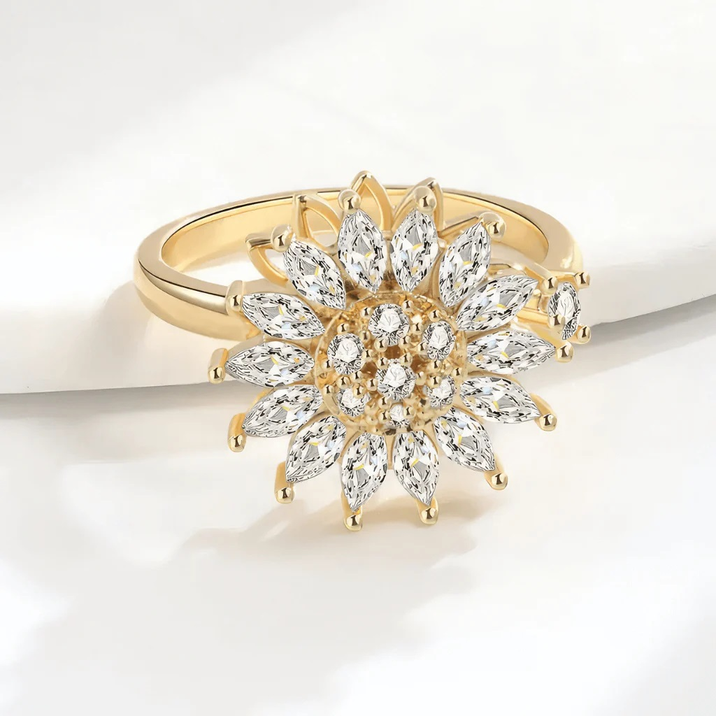 sunflower gold ring with a diamond design on a white background