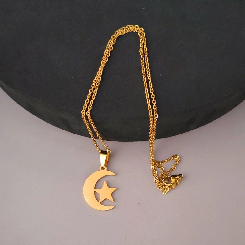 Elegant crescent star necklace Pakistan stylish Islamic pendant chain at black circle tray