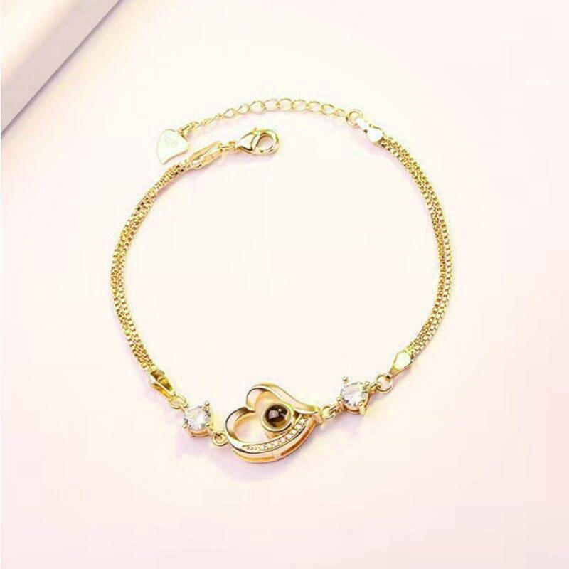 Close-up projection 100 languages bracelet Pakistan showing romantic jewelry design